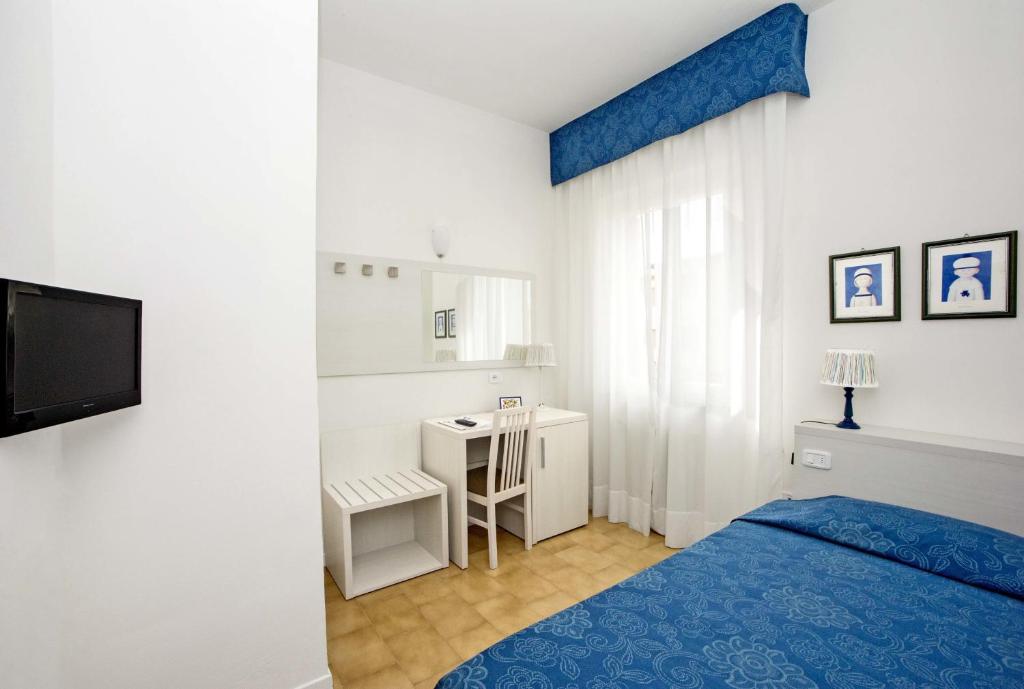 Posteľ alebo postele v izbe v ubytovaní Hotel Lucerna