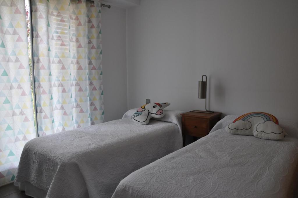 Postel nebo postele na pokoji v ubytování Les Suites Golf Bonmont