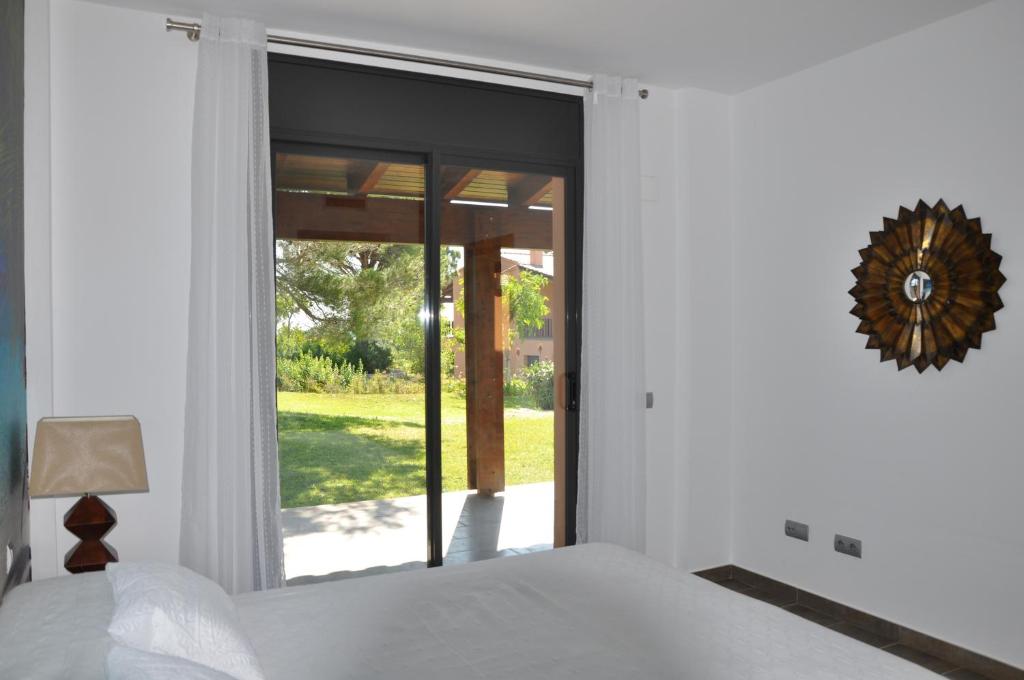 Postel nebo postele na pokoji v ubytování Les Suites Golf Bonmont