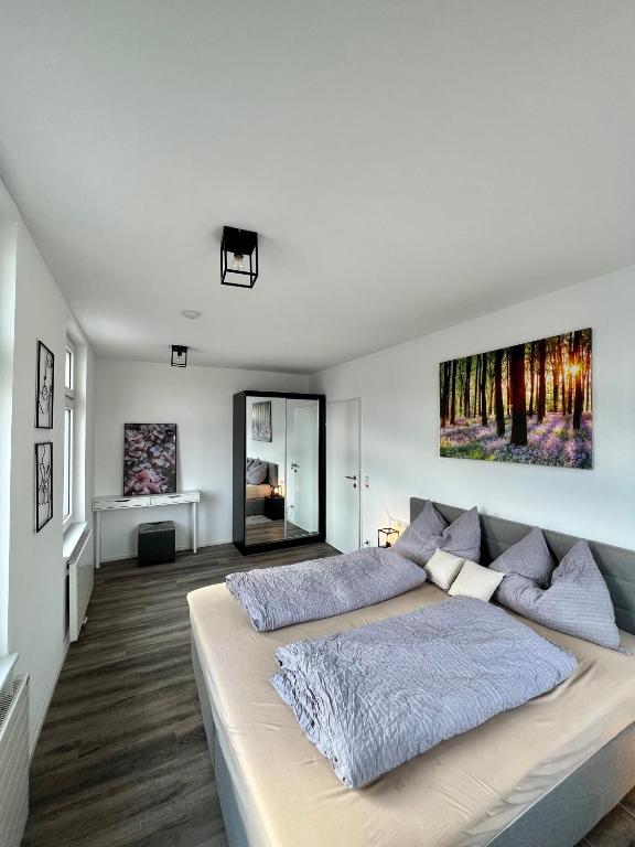Postel nebo postele na pokoji v ubytování Penthouse im Zentrum von Bregenz