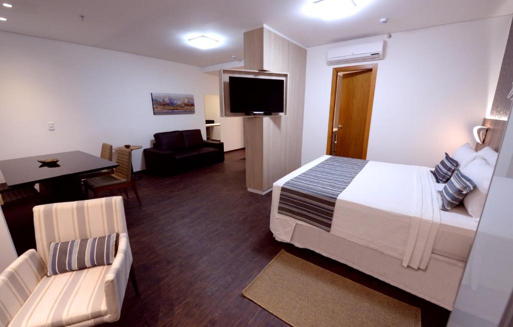 Postel nebo postele na pokoji v ubytování Allia Gran Pampulha Suites