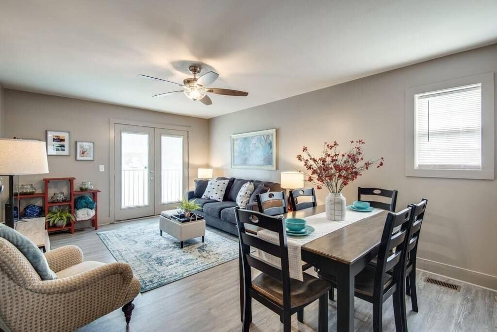 a living room with a table and a couch at The Lofts of Downtown (540 N 2nd St, #211) in Clarksville