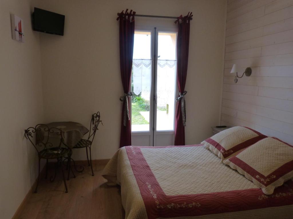 Postel nebo postele na pokoji v ubytování Gîte du Pagoulin - Chambres d'hôtes