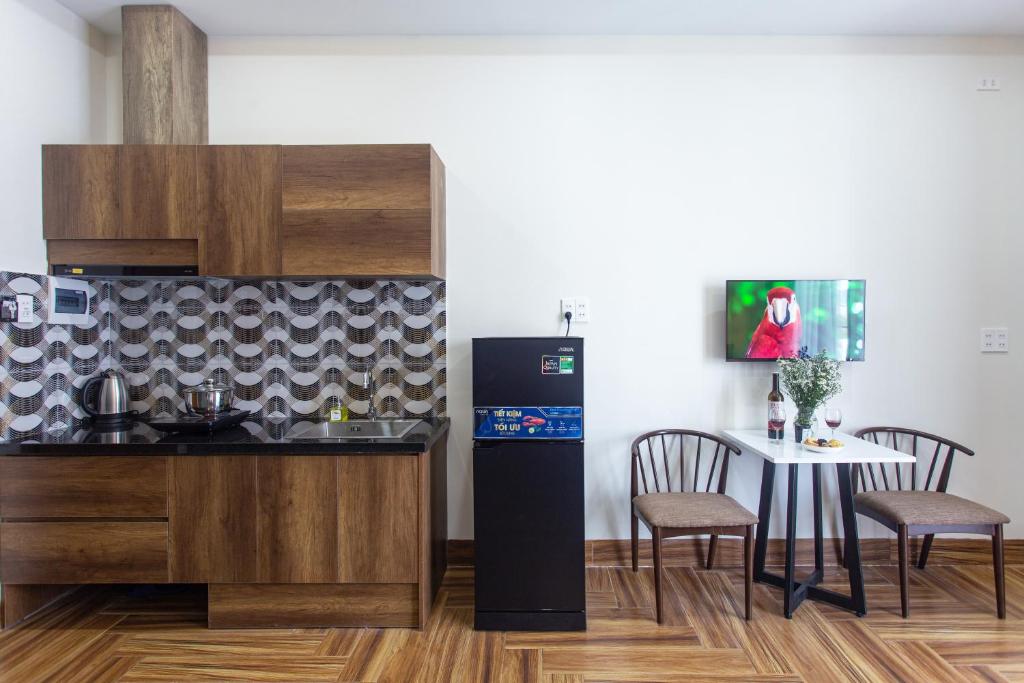 Kuchyň nebo kuchyňský kout v ubytování Le House Hotel and Studio