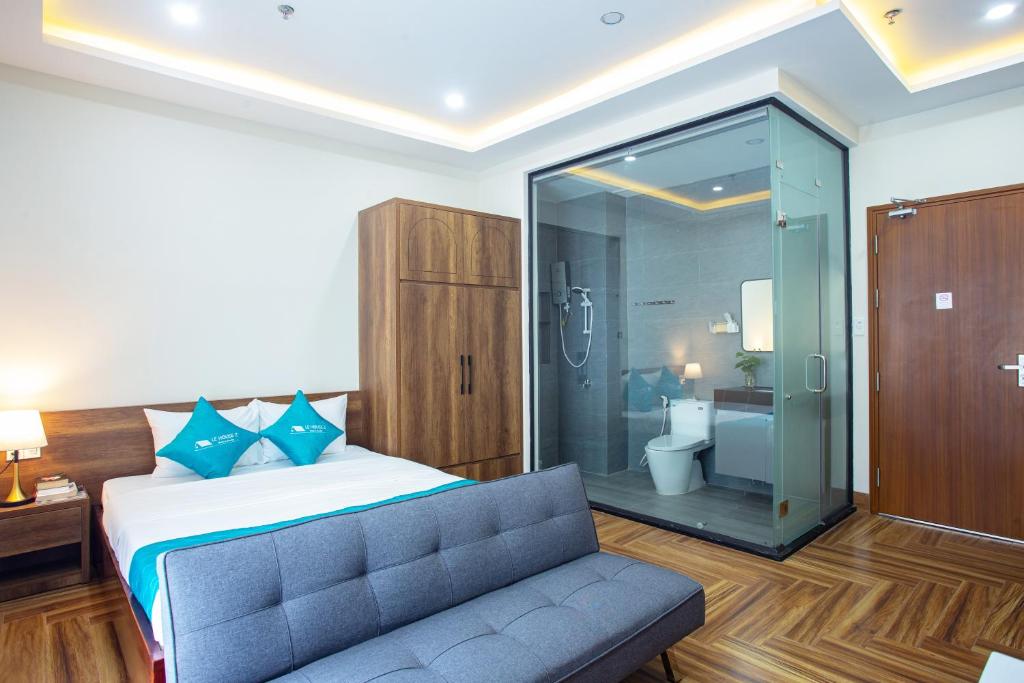 Postel nebo postele na pokoji v ubytování Le House Hotel and Studio