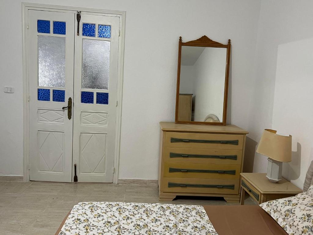 Postel nebo postele na pokoji v ubytování Dar Lilia Monastir