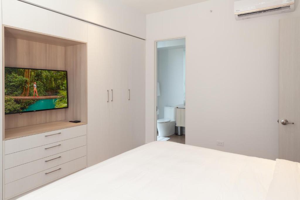 Postel nebo postele na pokoji v ubytování Residencias Cityzen cerca del Aeropuerto