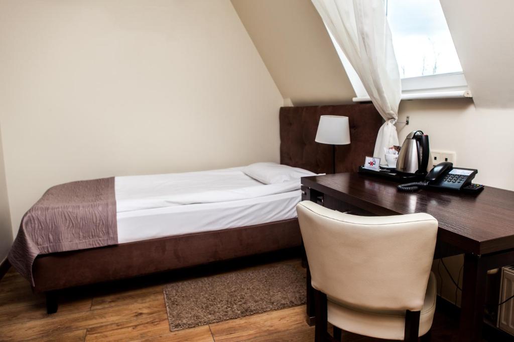 Postel nebo postele na pokoji v ubytování Hotel Bonum Old Town