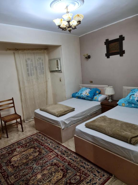Postel nebo postele na pokoji v ubytování Hello Pyramids inn