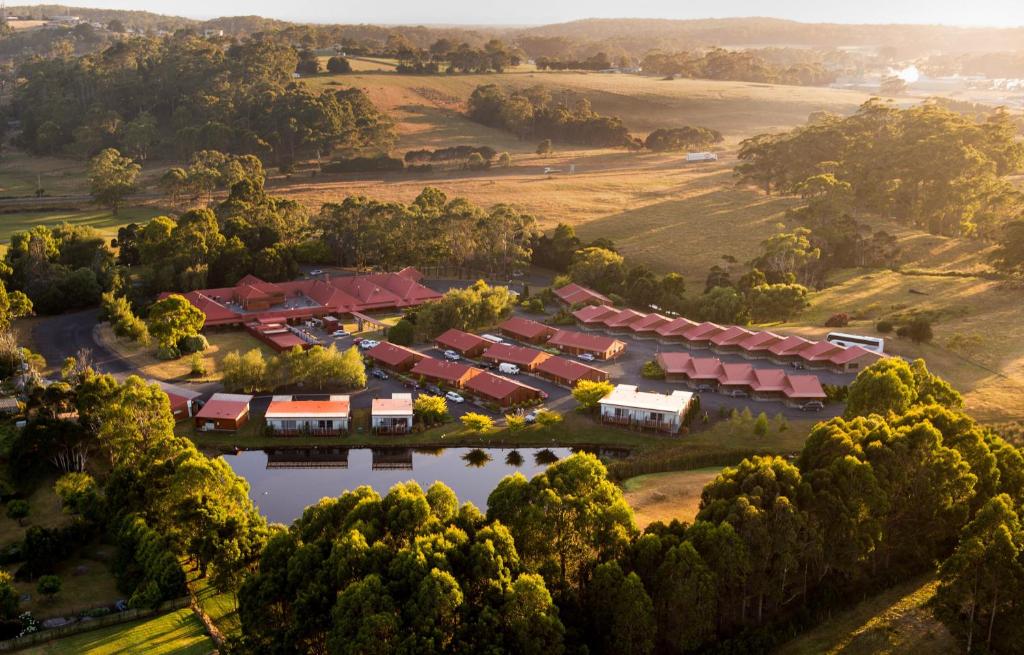 an aerial view of a resort with a lake and trees at Tall Timbers Tasmania in Smithton