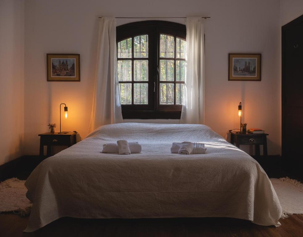 En eller flere senge i et værelse på Casa al pie de la Montaña