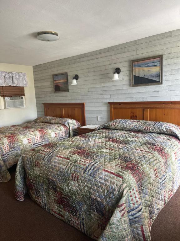 Кровать или кровати в номере Boulevard Motel