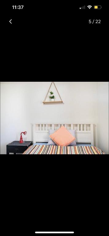 a picture of a bedroom with a bed and a desk at Private Room in Shared Accommodation in Redcliffe
