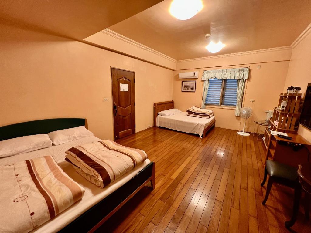 Postel nebo postele na pokoji v ubytování Sin Ya Homestay