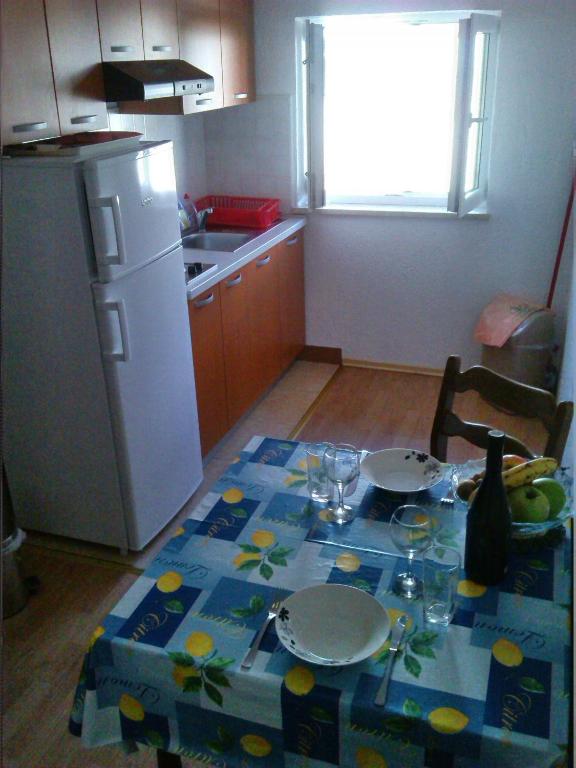 Kuchyňa alebo kuchynka v ubytovaní Apartments Cajic
