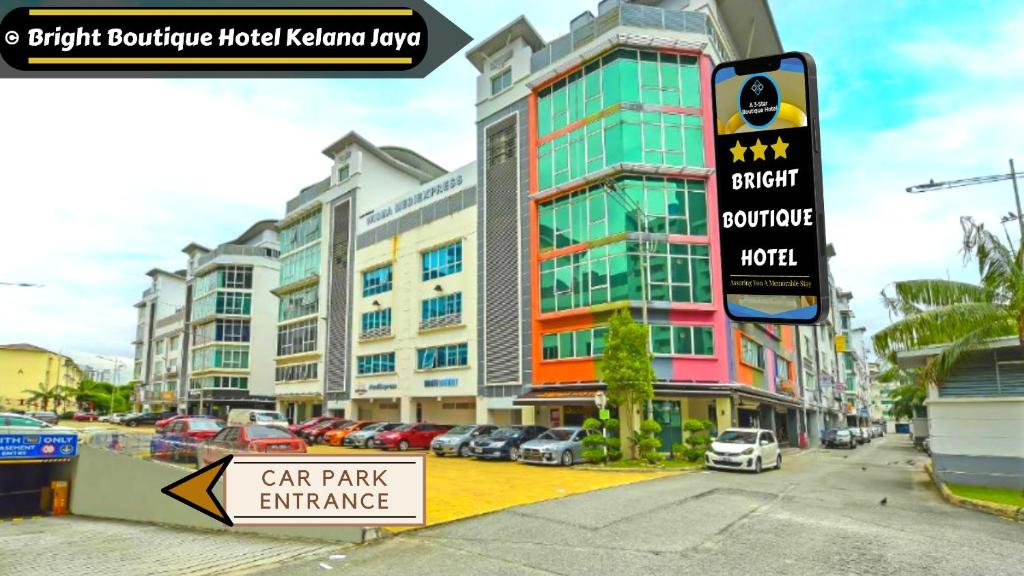 a car park entrance sign in front of a building at Bright Boutique Hotel Kelana Jaya in Petaling Jaya