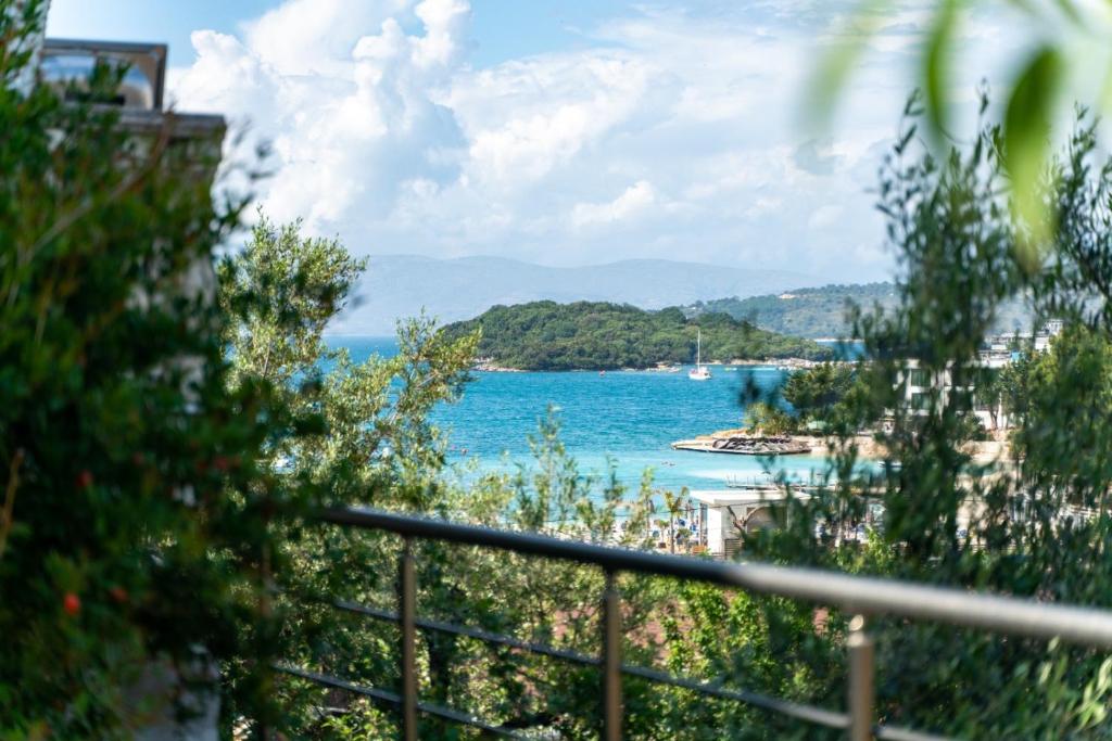 a view of a body of water from a balcony at Xhorxhi villa in Ksamil