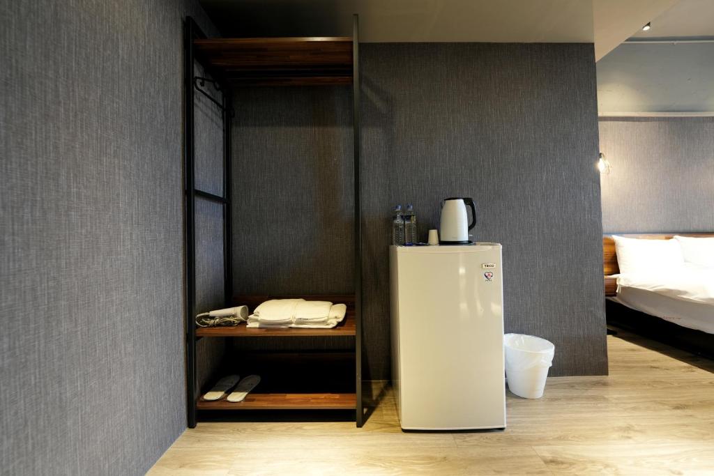 Postel nebo postele na pokoji v ubytování Meworld Hotel - Songshan
