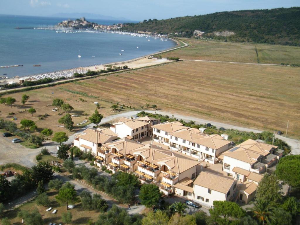 an aerial view of a resort next to the ocean at Residence Talamone Il Poderino in Talamone