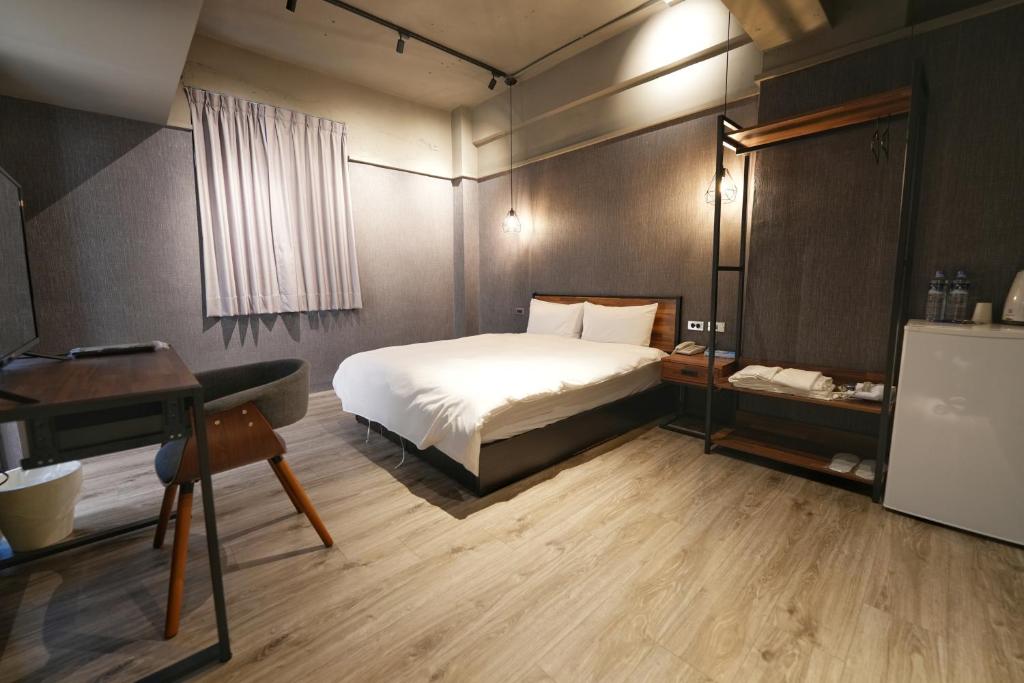 Postel nebo postele na pokoji v ubytování Meworld Hotel - Songshan