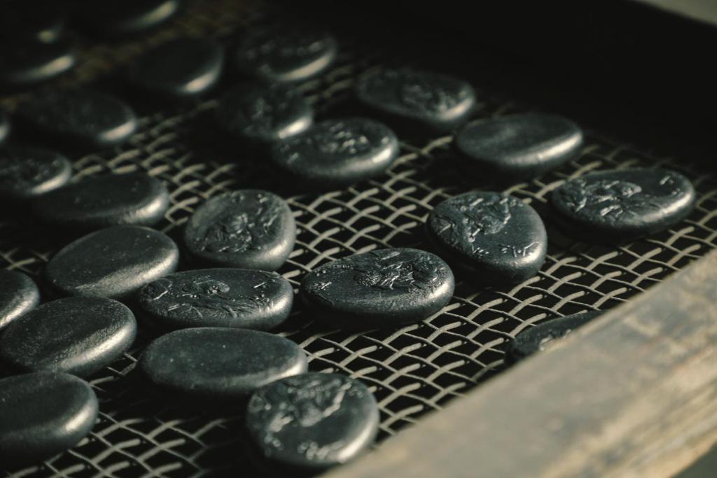 a bunch of black cookies sitting on a cooling rack at Shisui, a Luxury Collection Hotel, Nara in Nara