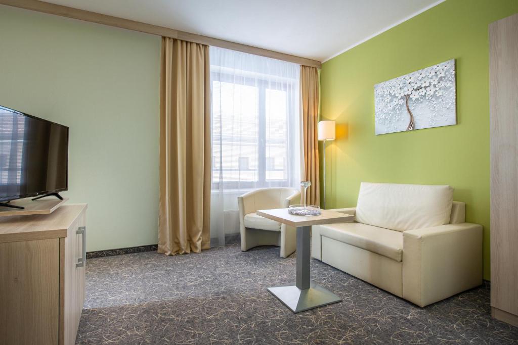 TV a/nebo společenská místnost v ubytování Hotel Mlynska