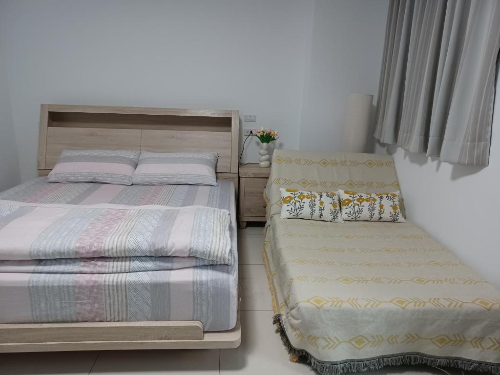 Postel nebo postele na pokoji v ubytování Daiwen Homestay