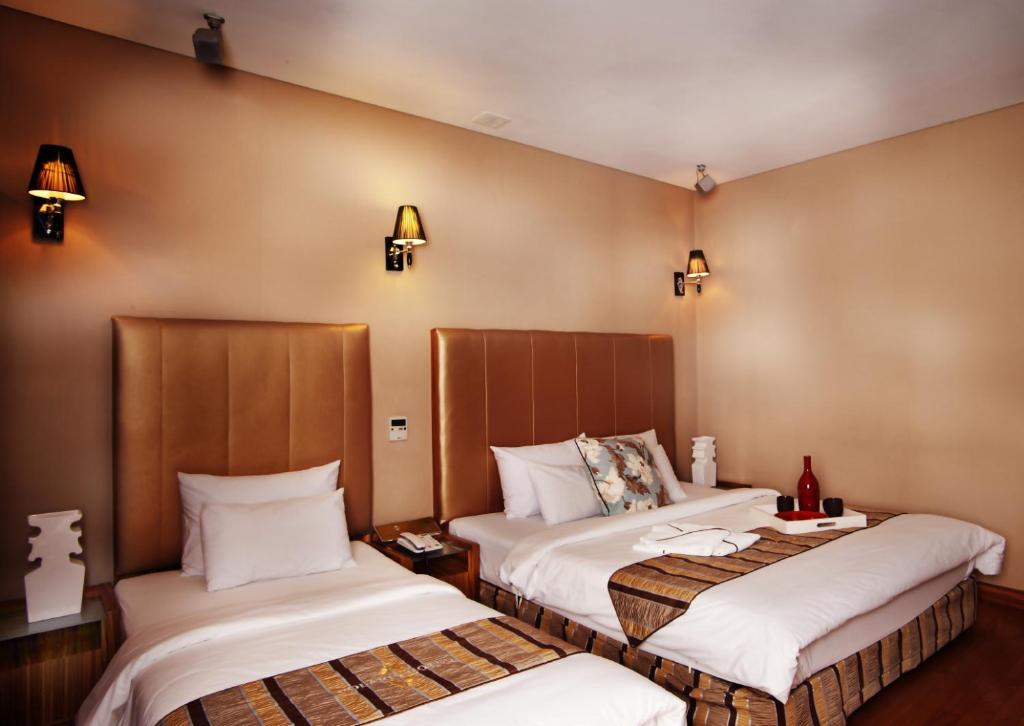 Postel nebo postele na pokoji v ubytování Polaris Hotel