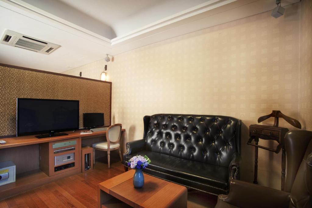 TV a/nebo společenská místnost v ubytování Polaris Hotel