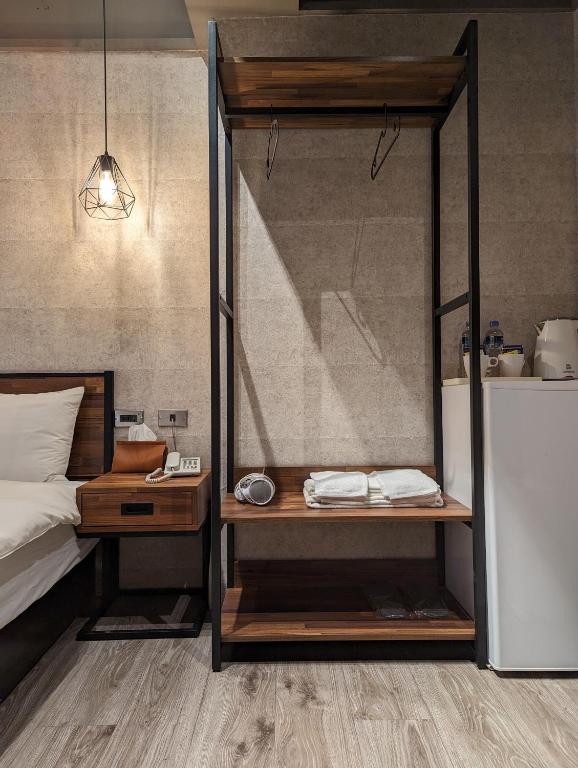 Postel nebo postele na pokoji v ubytování Meworld Hotel - Songshan