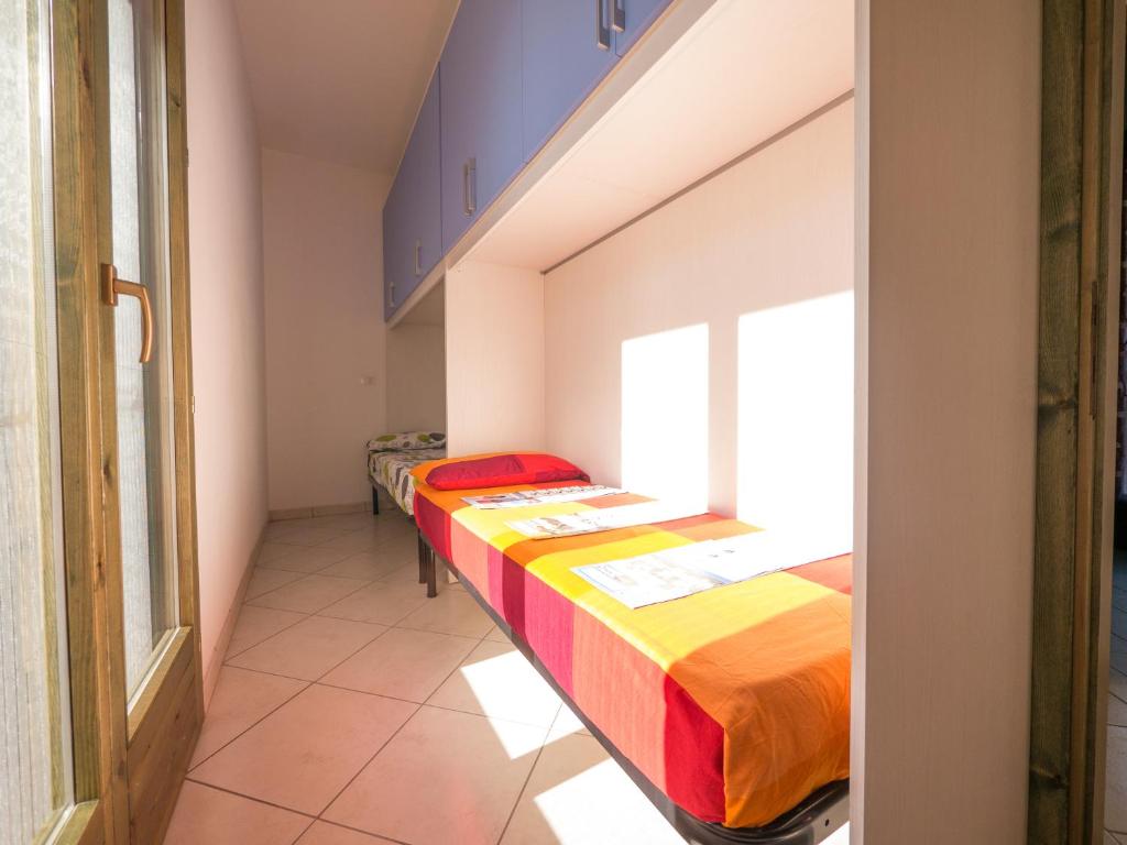 A bed or beds in a room at Pomposa Residence
