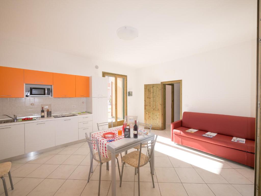 A kitchen or kitchenette at Pomposa Residence