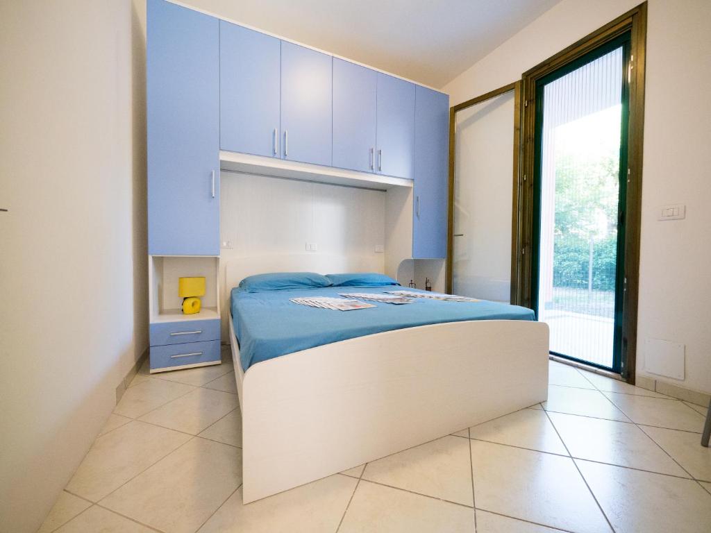 A bed or beds in a room at Pomposa Residence
