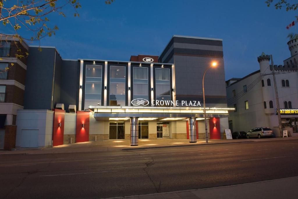 a building with a home pizza sign in front of it at Crowne Plaza Kitchener-Waterloo, an IHG Hotel in Kitchener