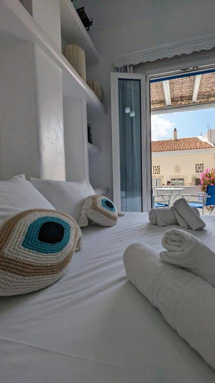Postel nebo postele na pokoji v ubytování Anoi Rooms