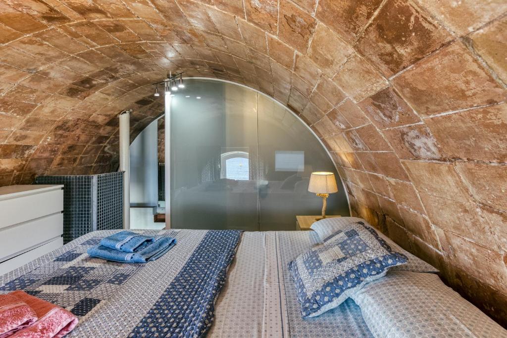 Postel nebo postele na pokoji v ubytování Loft Calella de Palafrugell