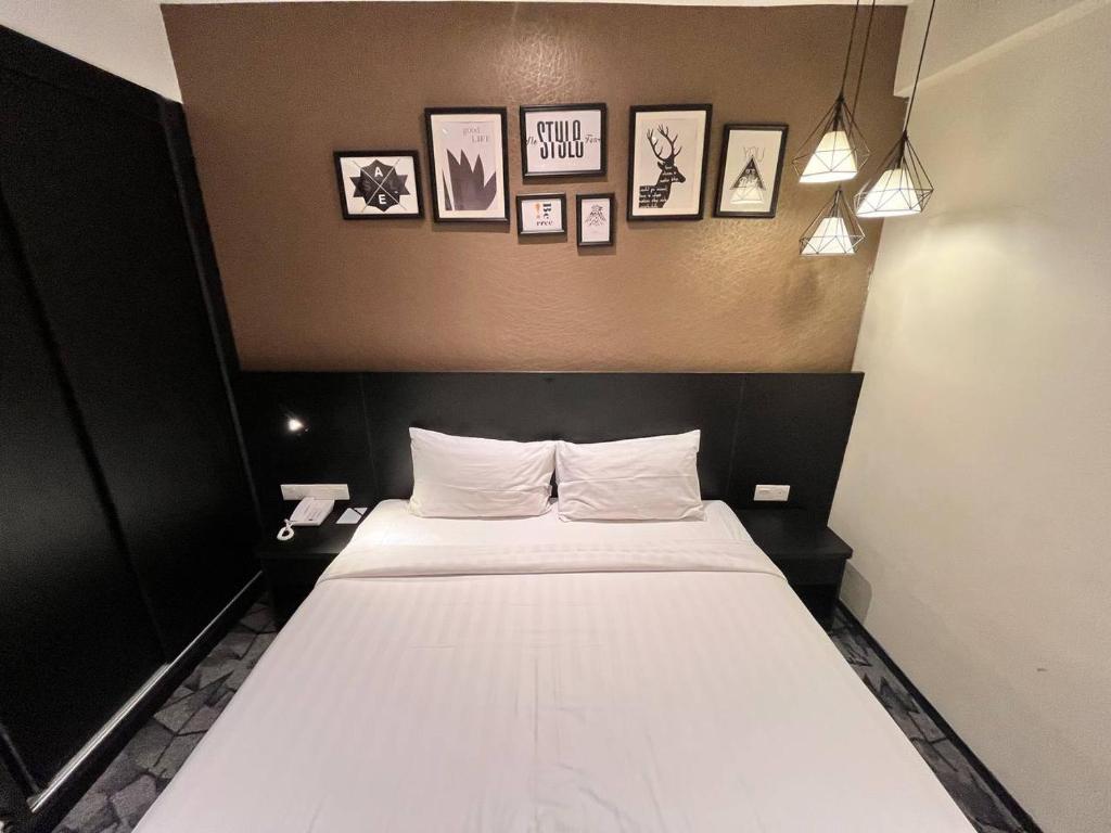 Postel nebo postele na pokoji v ubytování Hotel Damai Kuala Lumpur