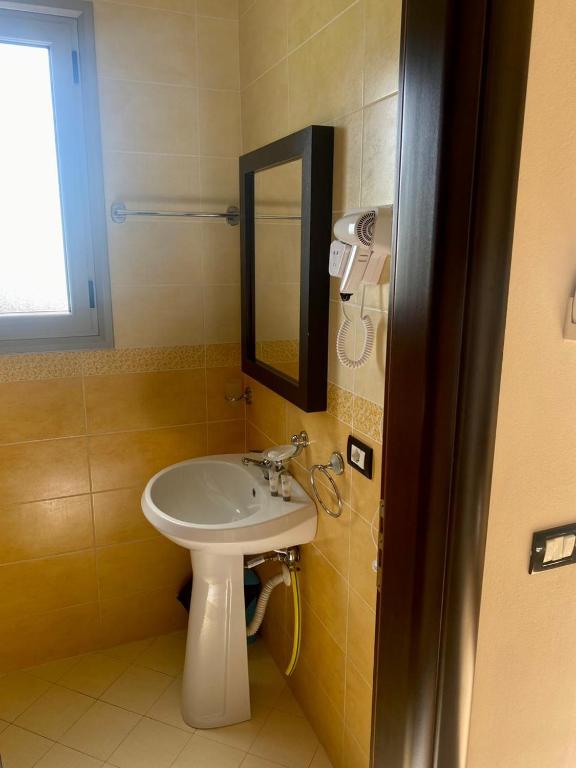 Koupelna v ubytování AL Hotel