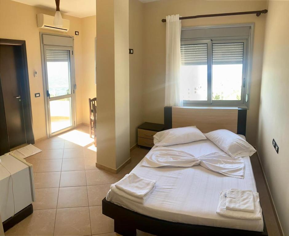 Postel nebo postele na pokoji v ubytování AL Hotel
