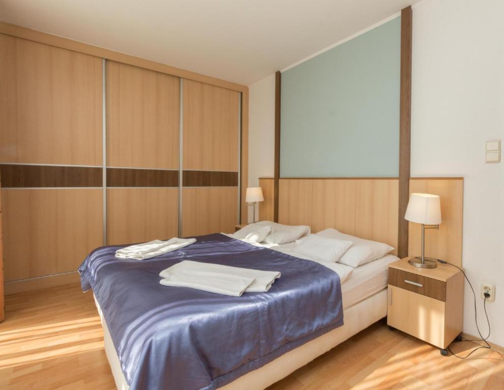 Posteľ alebo postele v izbe v ubytovaní Premium Apartments