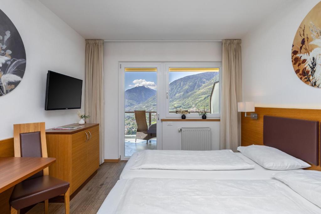 Postel nebo postele na pokoji v ubytování Hotel Panorama