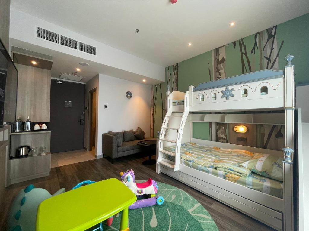 a childs bedroom with a bunk bed and a play room at KSL ESPLANADE HOTEL with HOT SPRING in Klang