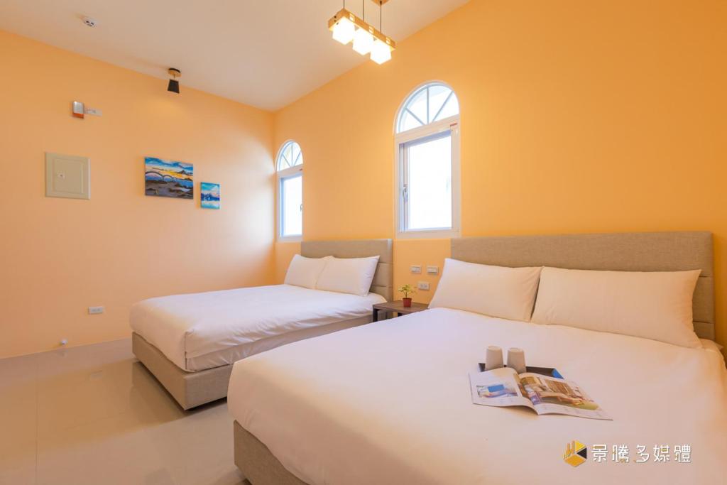 Postel nebo postele na pokoji v ubytování Tie Zhi Road B&B