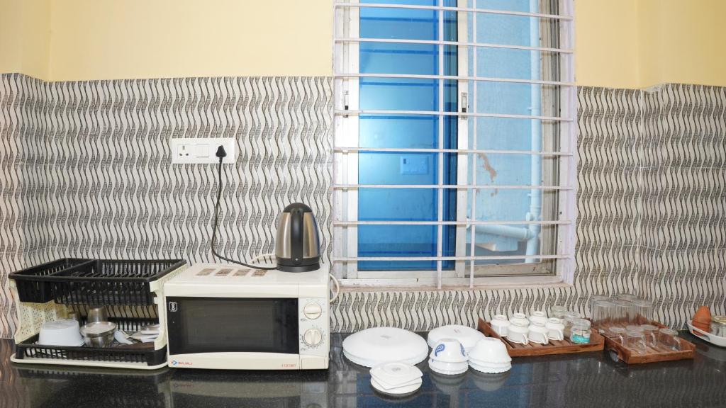Kuchyň nebo kuchyňský kout v ubytování The Royals Home Stay