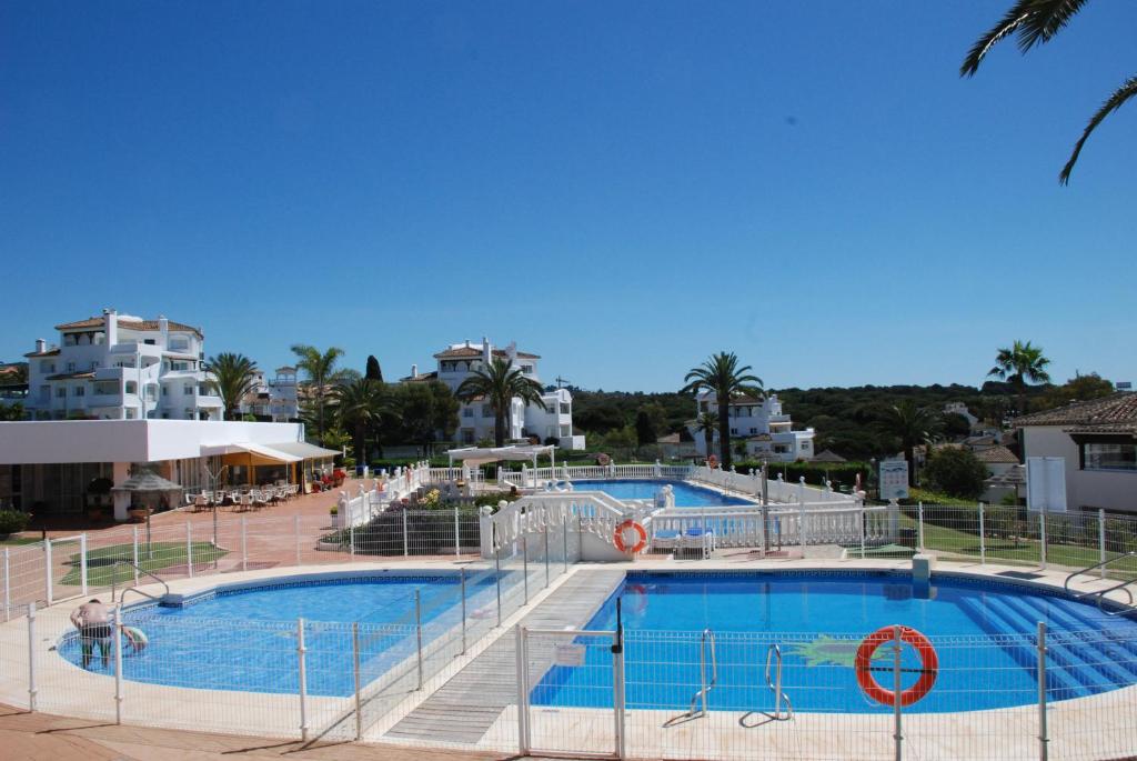 a large swimming pool in a resort at Casa Elviria Del Sol in Marbella