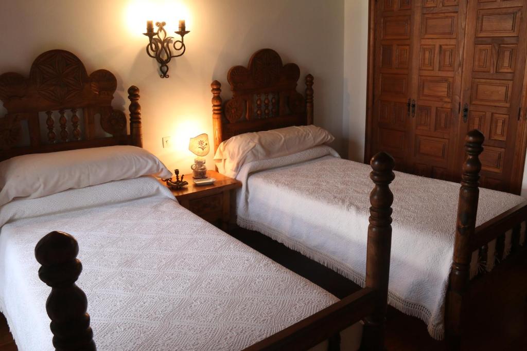 Posteľ alebo postele v izbe v ubytovaní Pazo de Ceilán