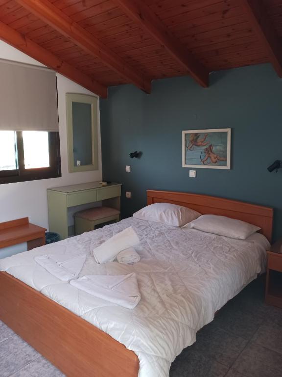 Postel nebo postele na pokoji v ubytování Soulis Hotel