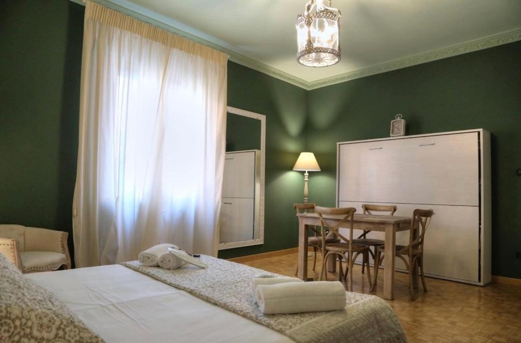 Postel nebo postele na pokoji v ubytování La Casetta di Lina Rooms and Apartments