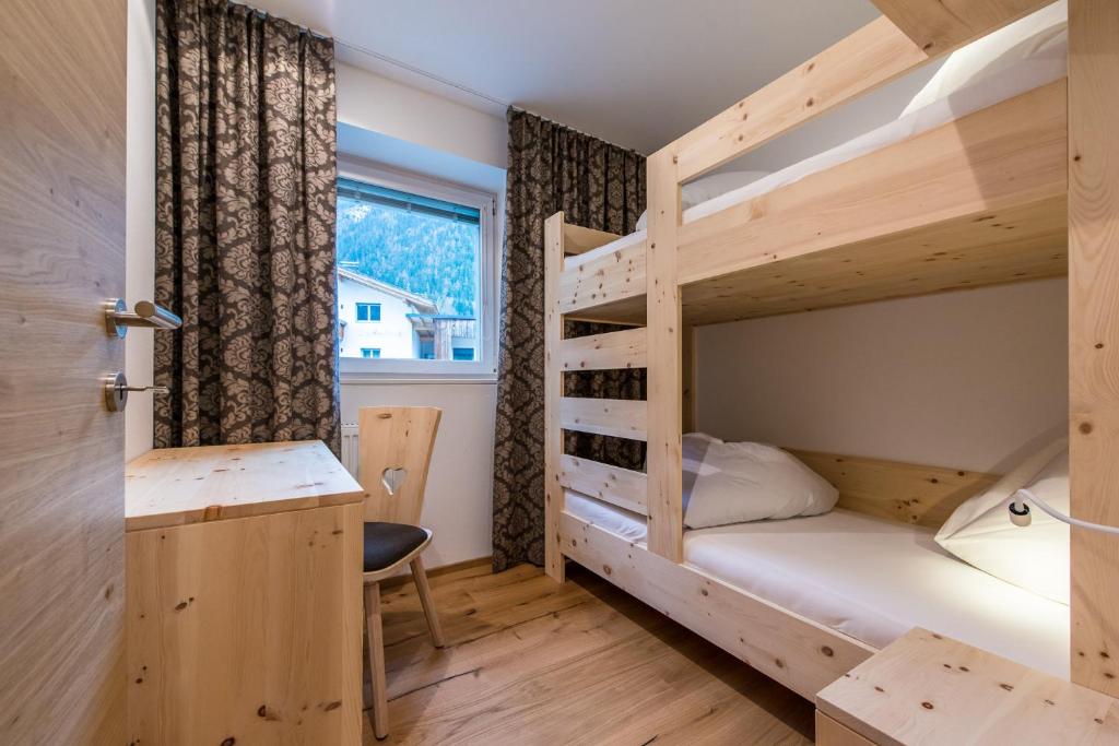 Postel nebo postele na pokoji v ubytování Hotel Antholzerhof