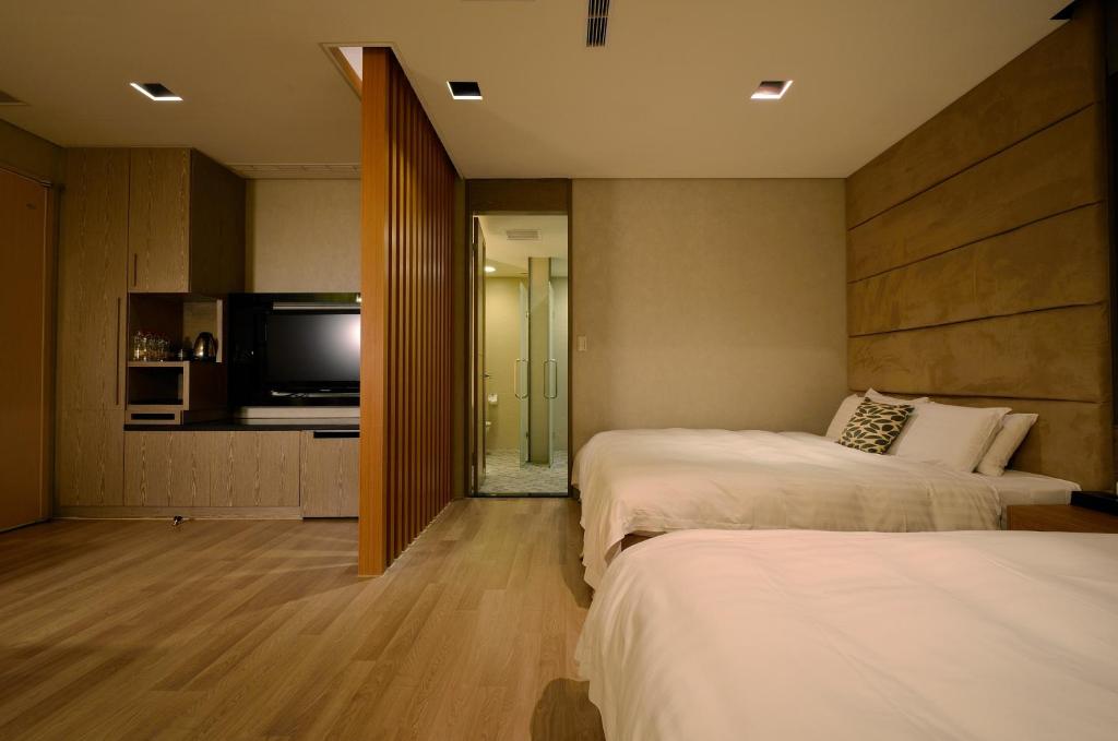 Una cama o camas en una habitaci&oacute;n de The Sun Hot Spring &amp; Resort